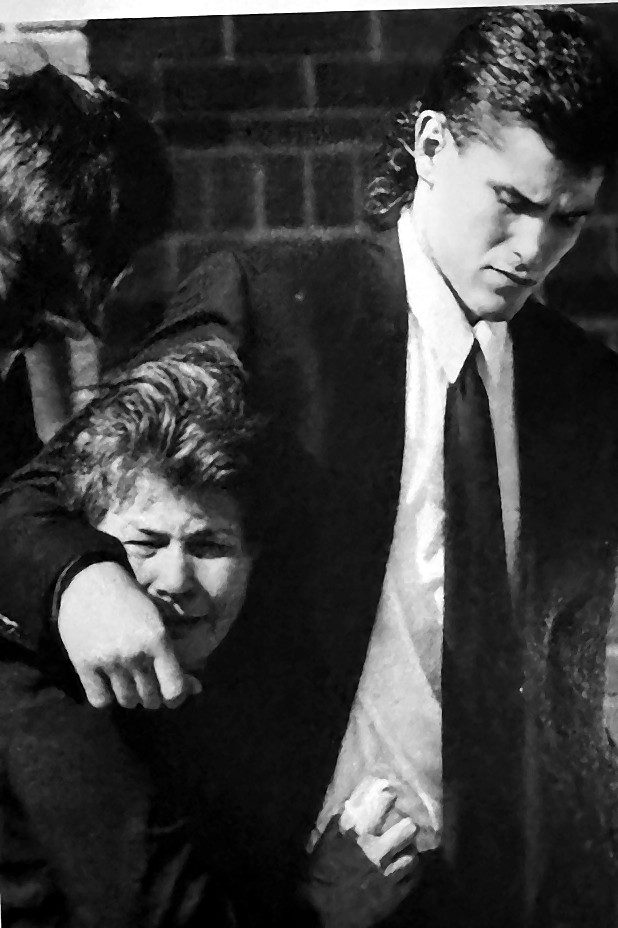 Dan Kordic supporting his mother Regina at John Kordic's funeral