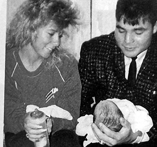 John Kordic holding his goddaughter Nicole as a newborn
