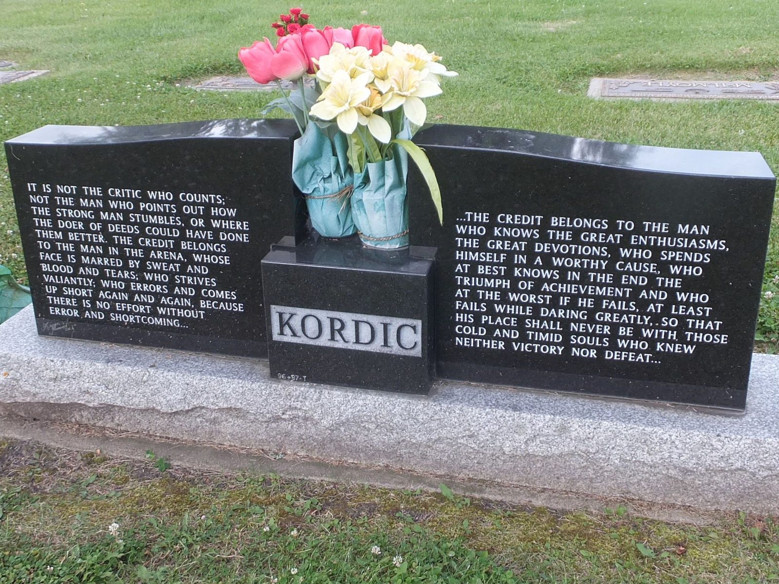 The Kordic headstone engraved with Theodore Roosevelt's 'The Man in the Arena' passage